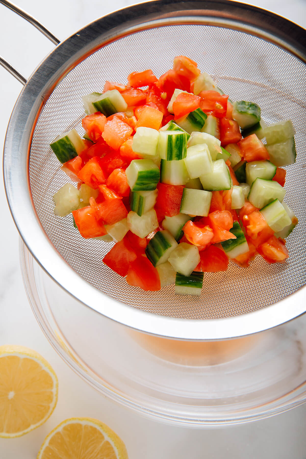 drained tomatoes and cucumber